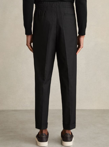 Relaxed-Fit Pleated Tapered Trousers